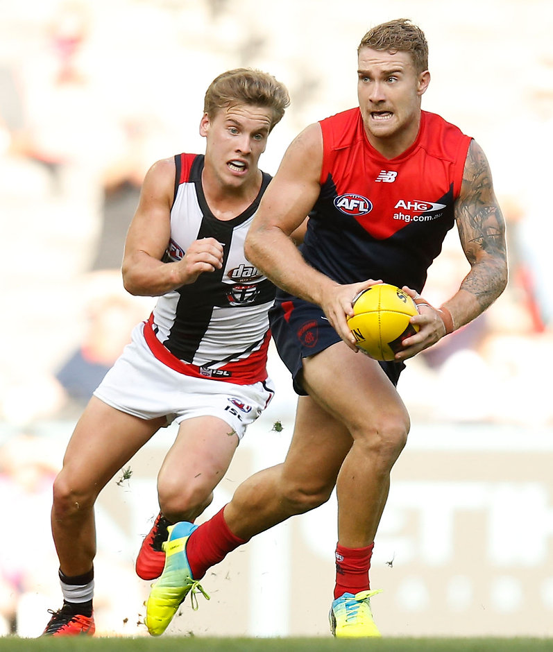 AFL 2016 NAB Challenge - Melbourne v St Kilda MELBOURNE, AUSTRALIA - MARCH 13: Dean Kent of the Demons is chased by Jack Lonie of the Saints during the 2016 NAB Challenge match between the Melbourne Demons and the St Kilda Saints at Etihad Stadium, Melbourne on March 13, 2016. (Photo by Michael Willson/AFL Media)